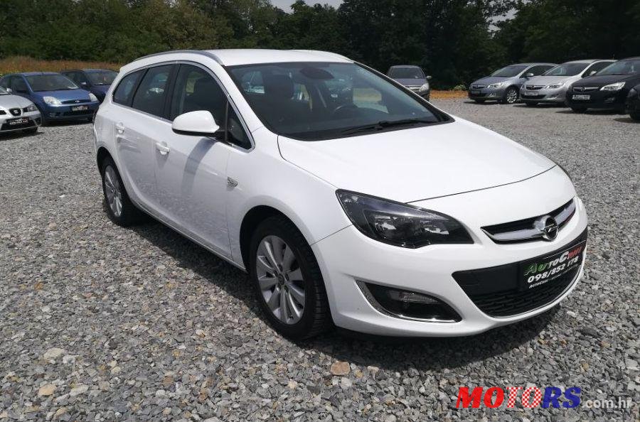 2014' Opel Astra Karavan photo #1