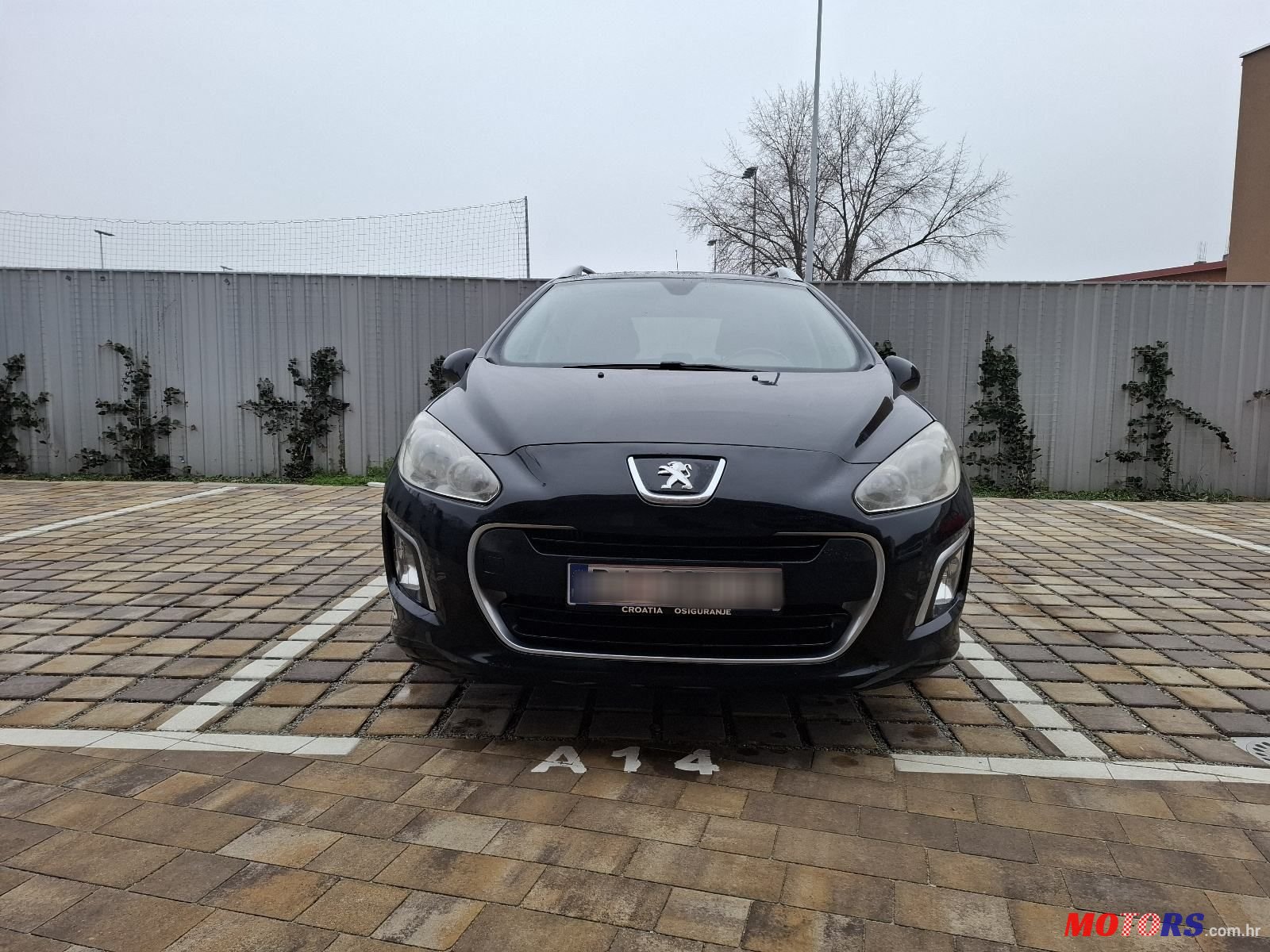 2012' Peugeot 308 Sw photo #1