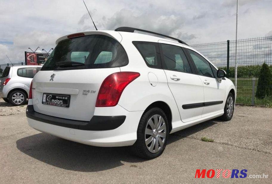 2012' Peugeot 308 Sw photo #1