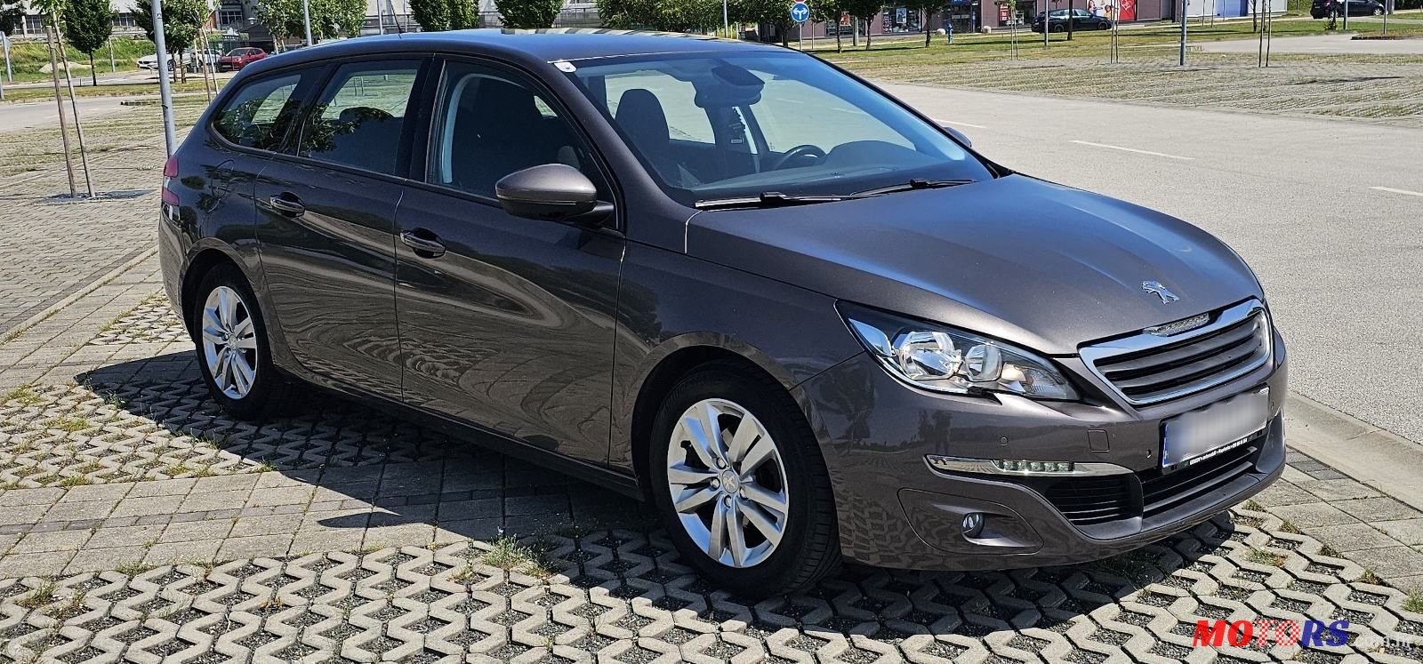 2015' Peugeot 308 Sw photo #1