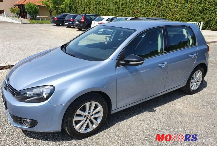 2012' Volkswagen Golf VI 1,6 Tdi photo #1