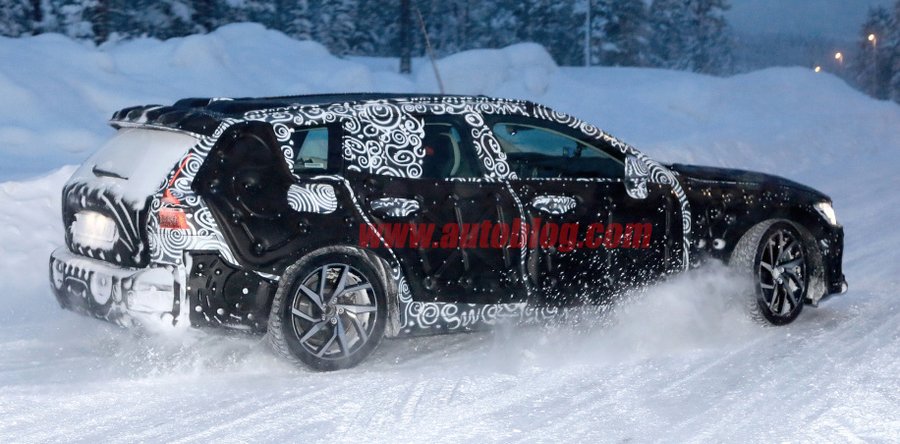 Volvo V60 hybrid wagon spied covered in snow and camouflage