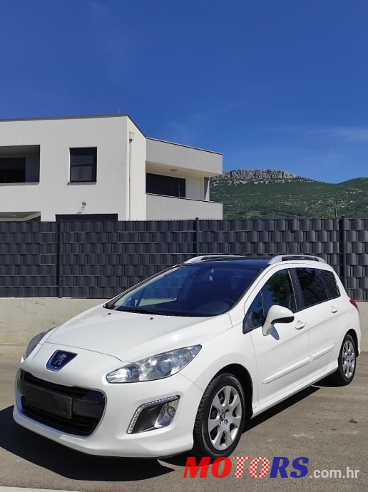 2014' Peugeot 308 Sw photo #1