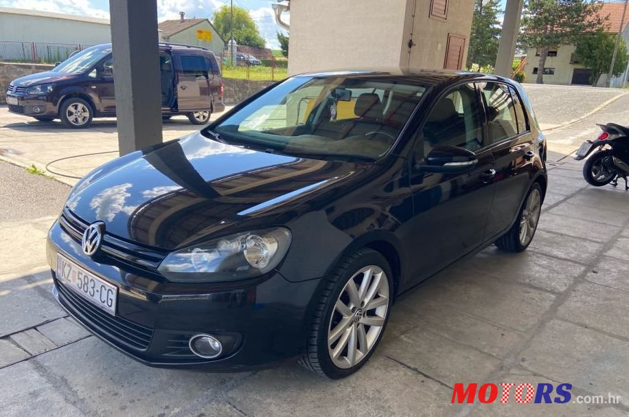 2012' Volkswagen Golf VI 1,6 Tdi photo #1