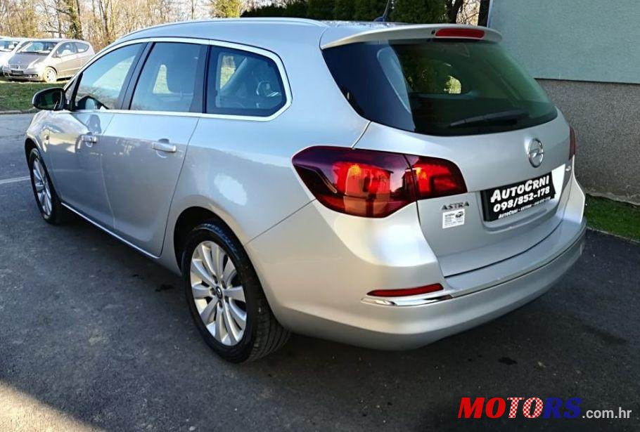 2014' Opel Astra Karavan photo #1