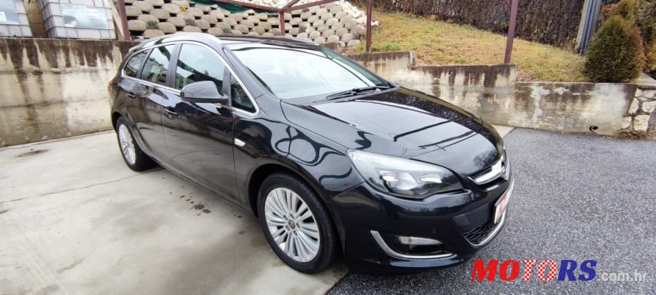 2014' Opel Astra Karavan photo #1