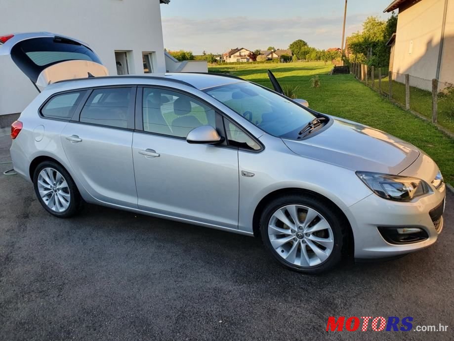 2014' Opel Astra Karavan photo #2