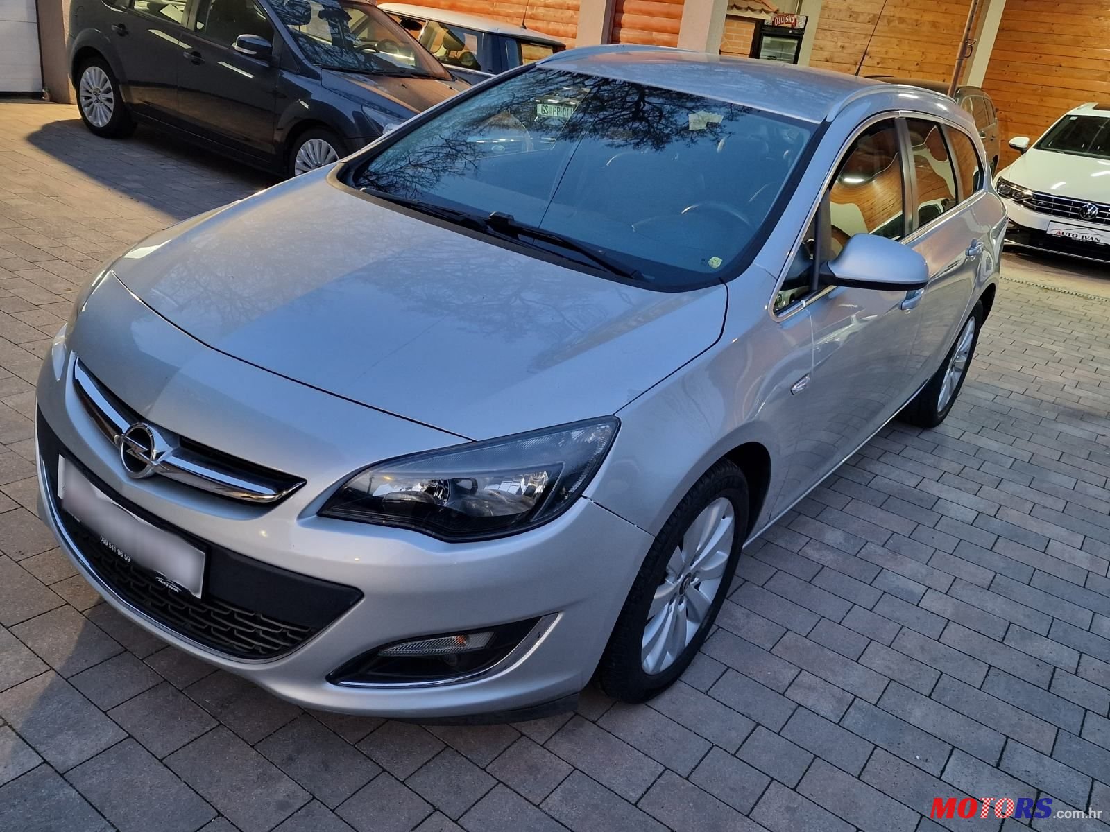 2014' Opel Astra Karavan photo #1