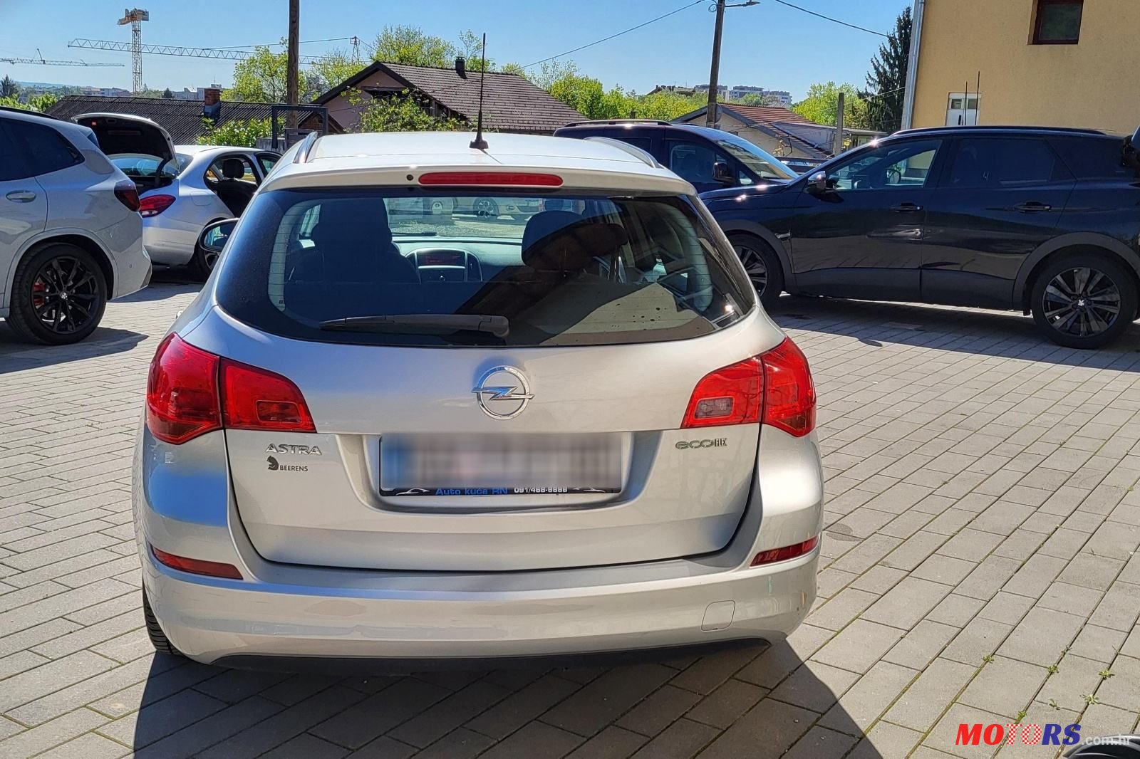 2011' Opel Astra Karavan photo #1