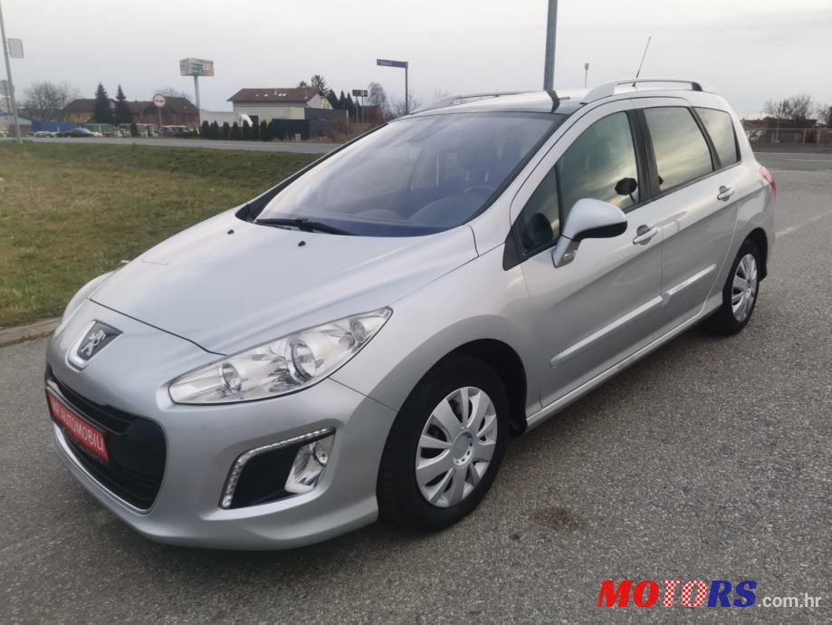 2012' Peugeot 308 Sw photo #1