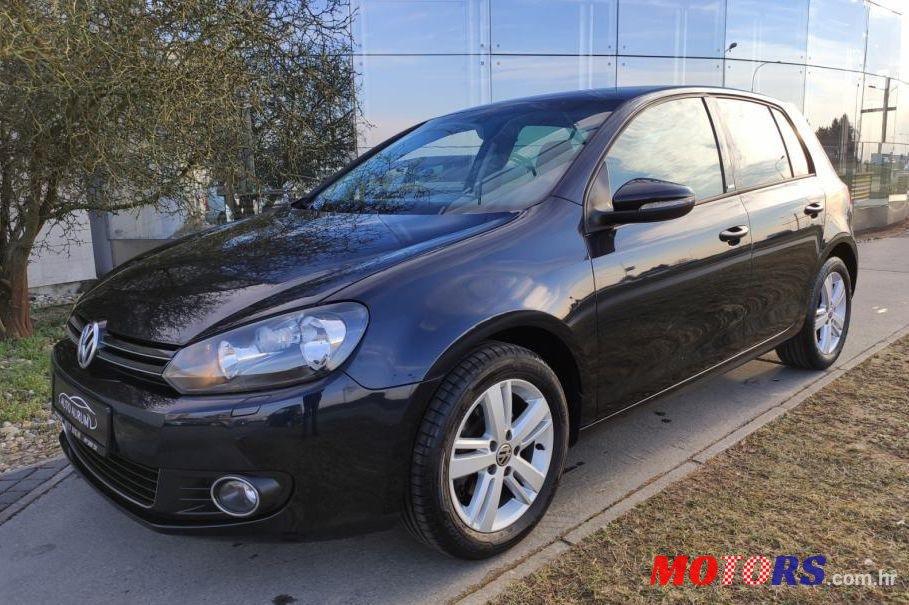 2011' Volkswagen Golf VI 1,6 Tdi photo #1