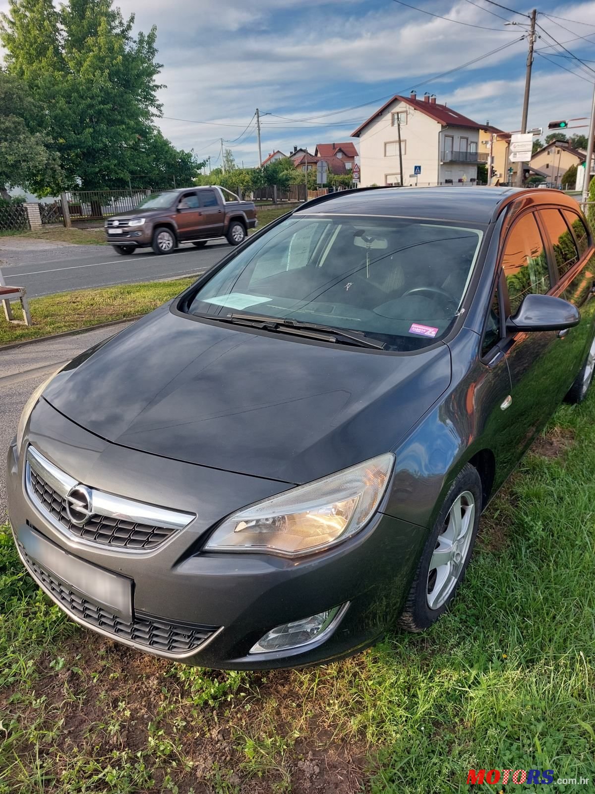 2011' Opel Astra Karavan photo #6