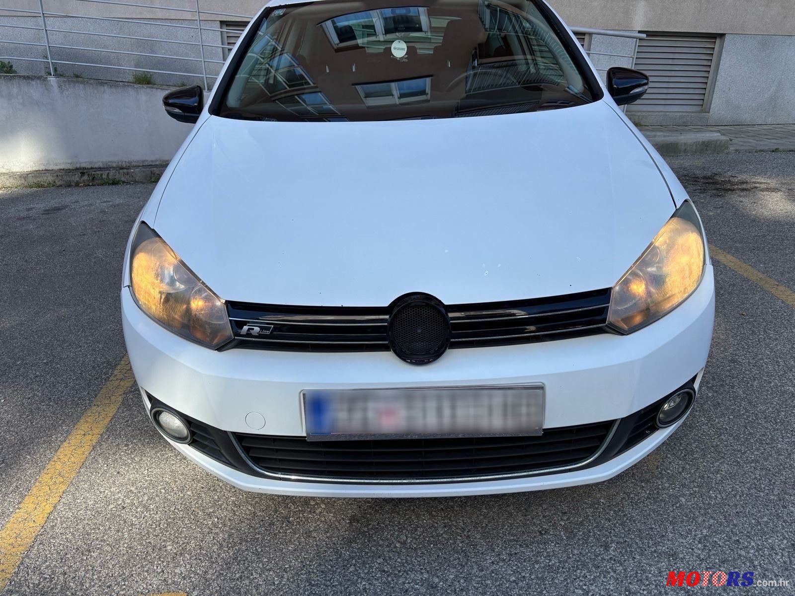 2012' Volkswagen Golf VI 1,6 Tdi photo #3
