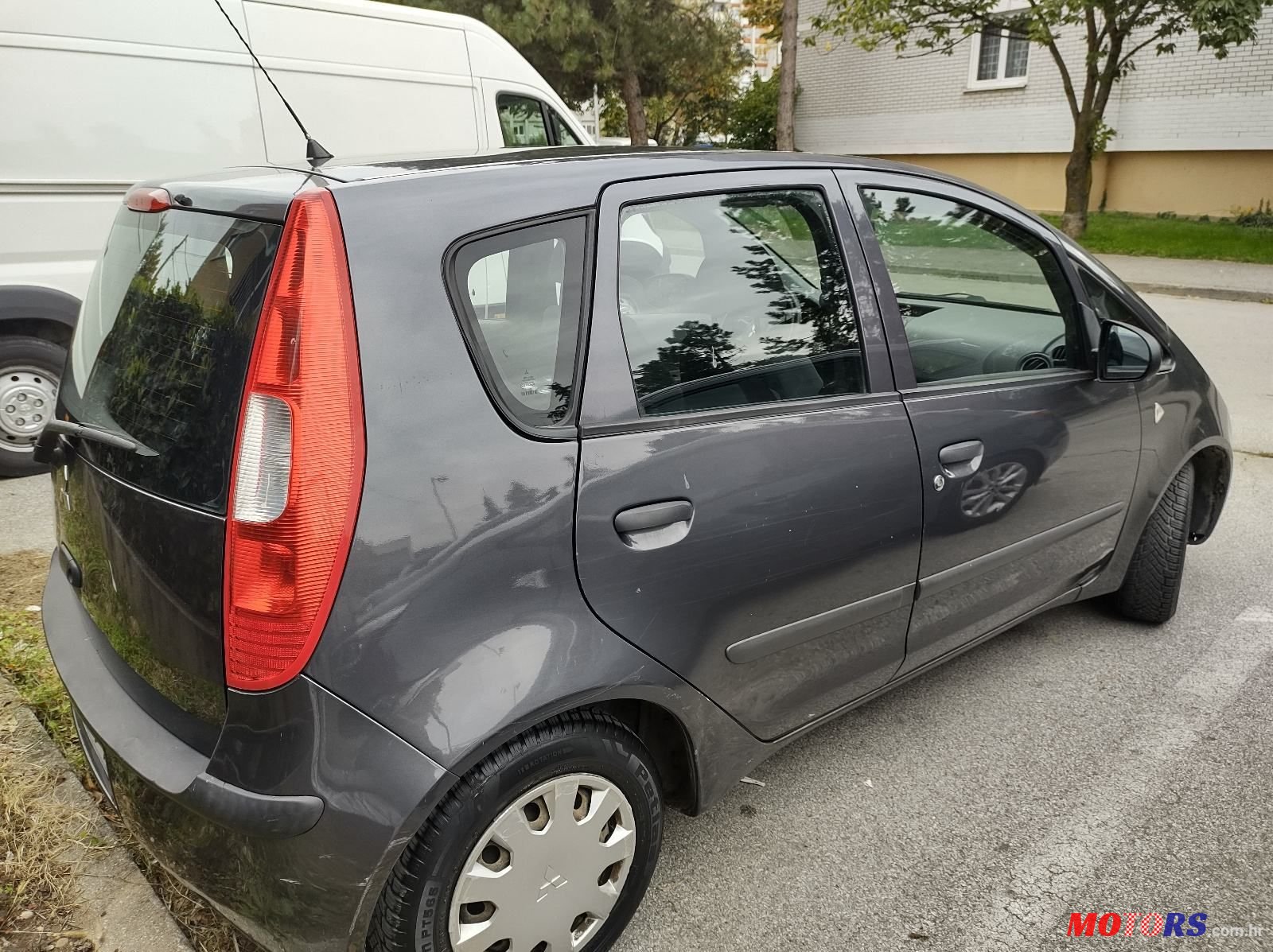 2004' Mitsubishi Colt 1,1 photo #1