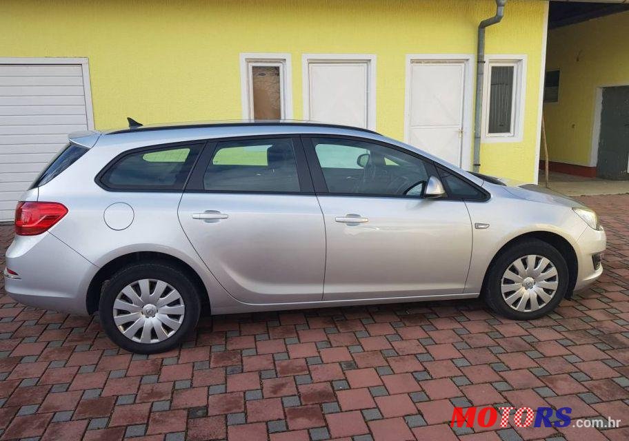 2014' Opel Astra Karavan Sports photo #1