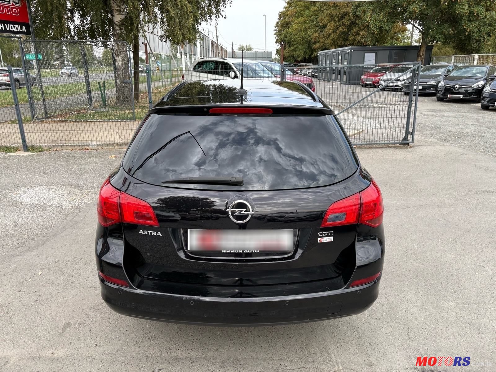 2011' Opel Astra Karavan photo #5