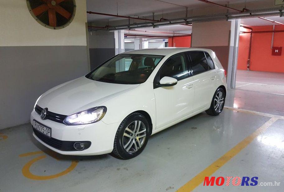 2012' Volkswagen Golf VI 1,6 Tdi photo #1