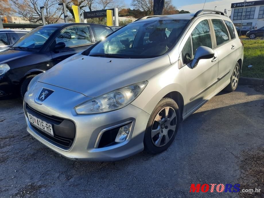 2011' Peugeot 308 Sw photo #1