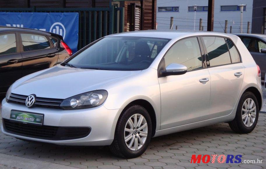 2011' Volkswagen Golf VI 1,6 Tdi photo #1