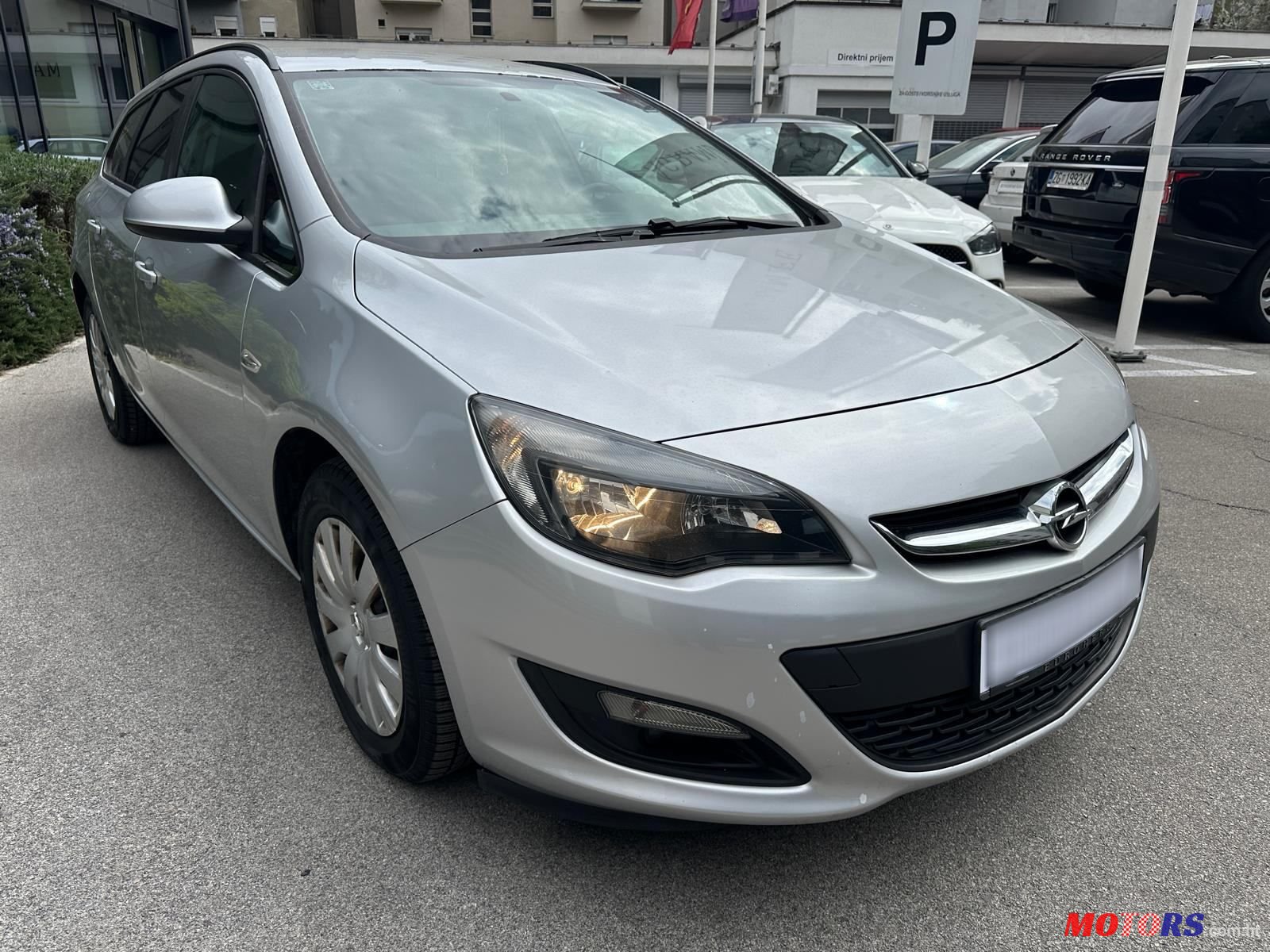 2014' Opel Astra Karavan photo #1