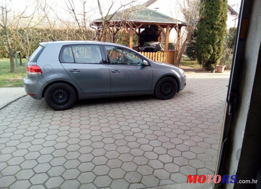 2011' Volkswagen Golf VI 1,6 Tdi photo #1