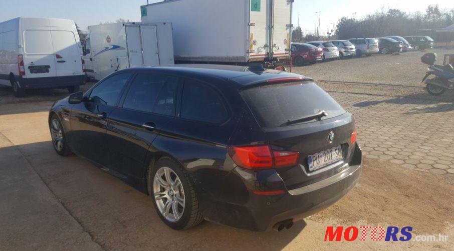 2011' BMW 5 Series 520D photo #1