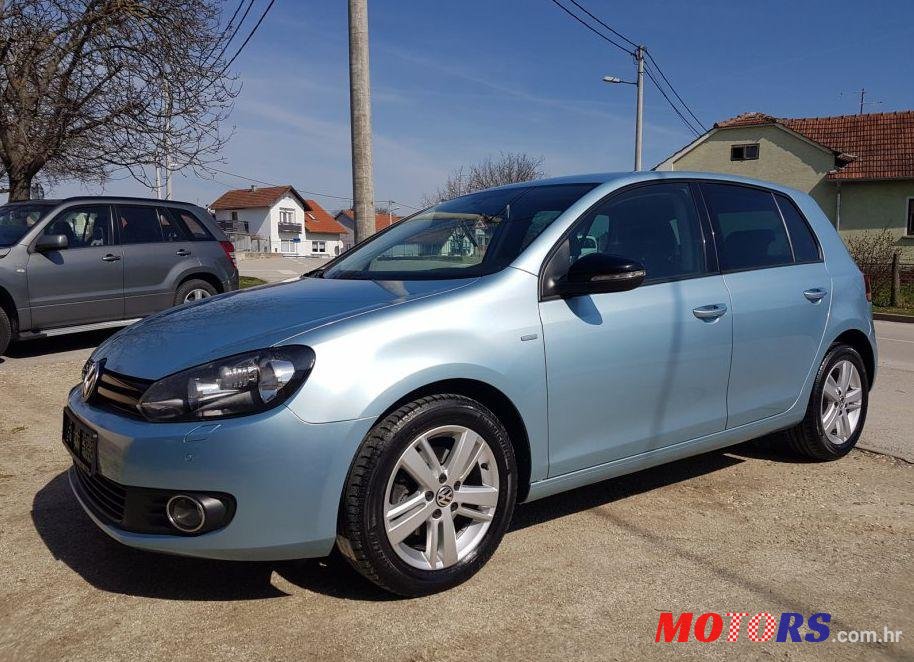 2012' Volkswagen Golf VI 1,6 Tdi photo #1