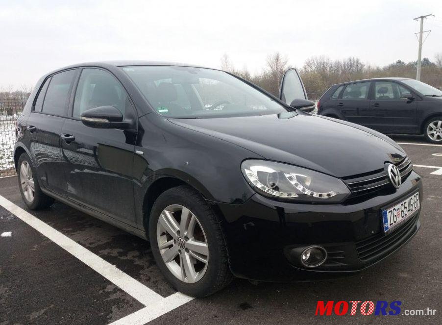 2012' Volkswagen Golf VI 1,6 Tdi photo #1