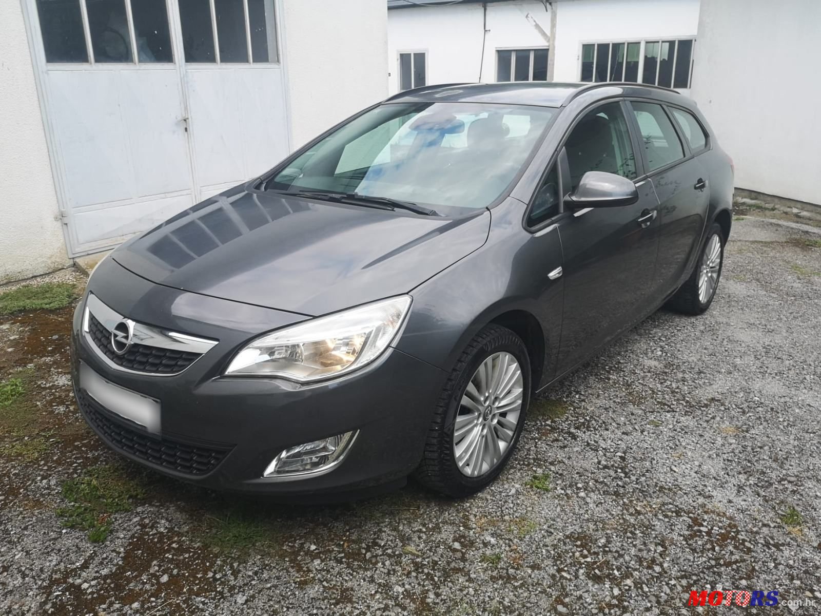 2012' Opel Astra Karavan photo #1