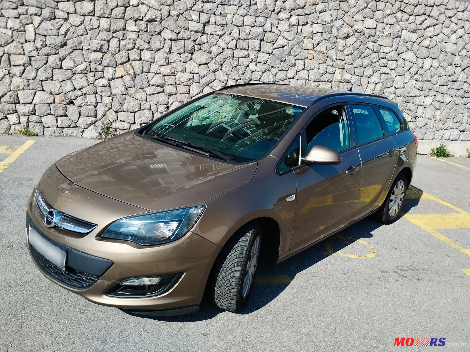 2014' Opel Astra Karavan photo #1