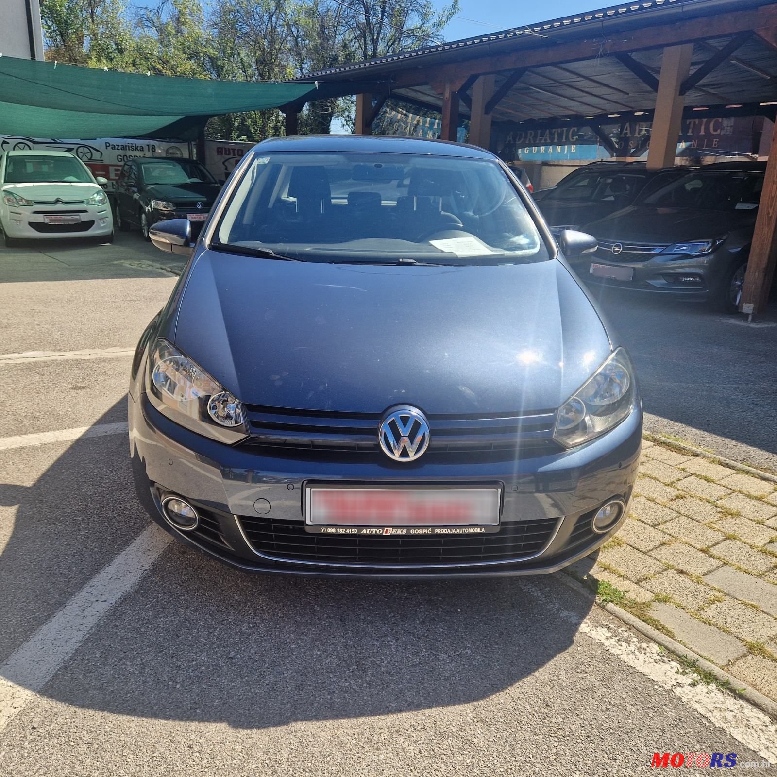 2011' Volkswagen Golf VI 1,6 Tdi photo #2