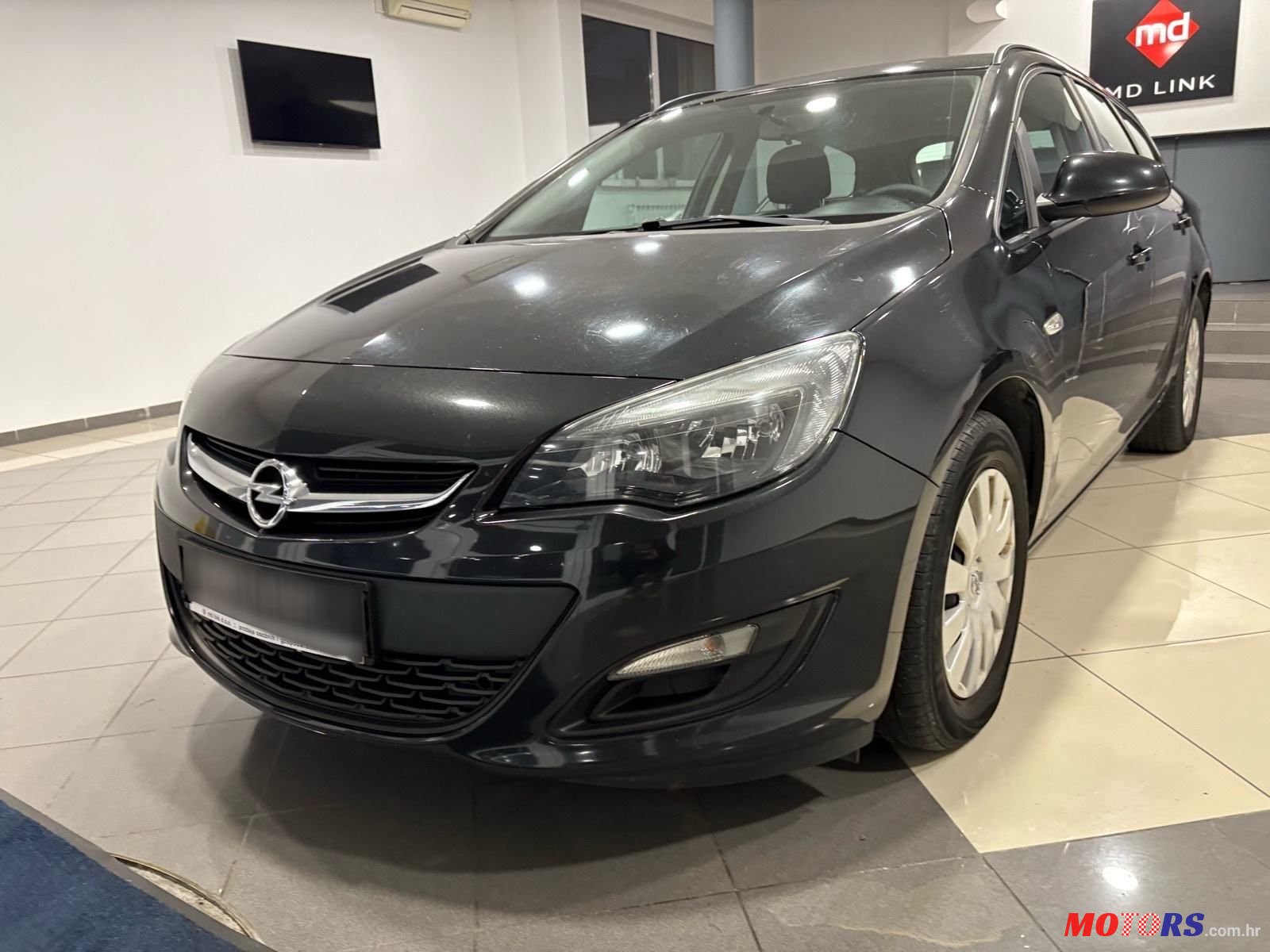 2013' Opel Astra Karavan photo #1