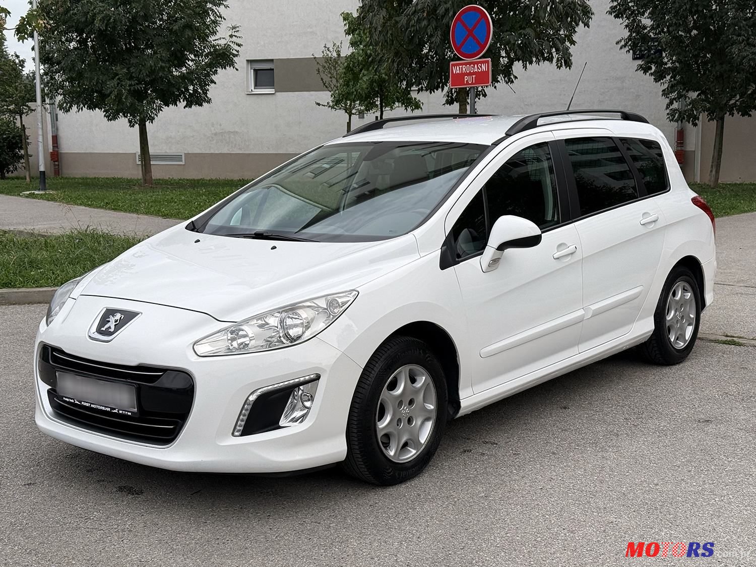 2014' Peugeot 308 Sw photo #1