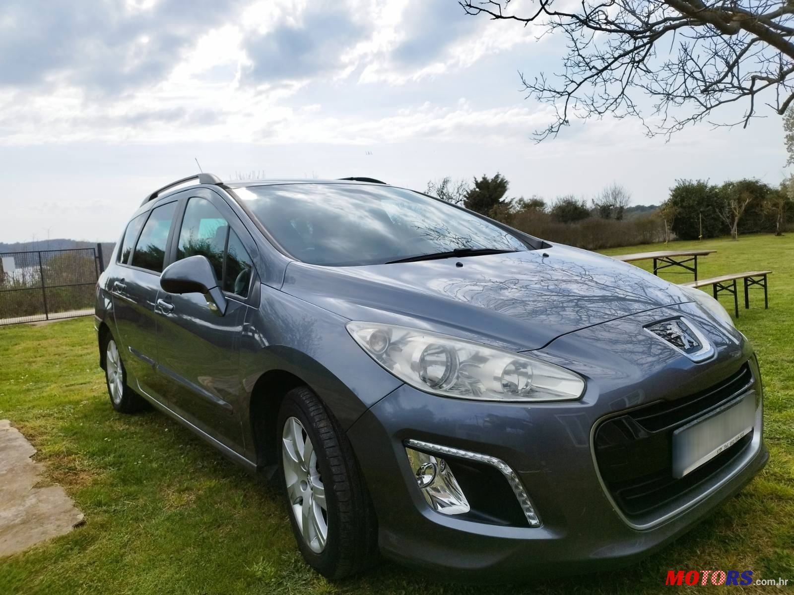 2012' Peugeot 308 Sw photo #1