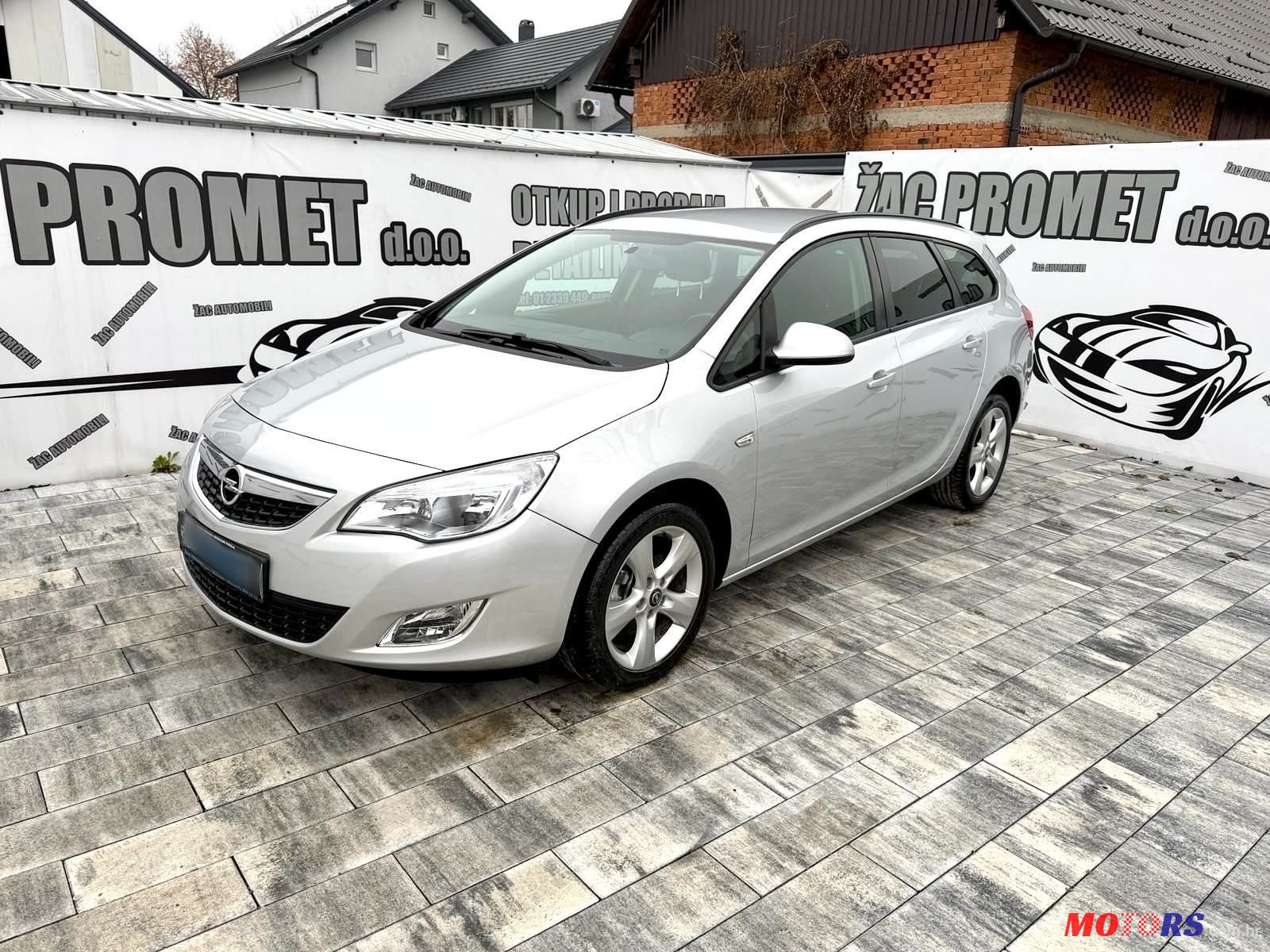 2011' Opel Astra Karavan photo #1