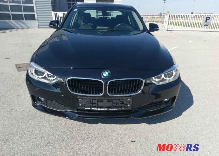 2013' BMW 3 Series 318D photo #1